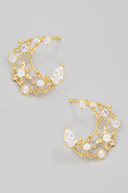 Aretes dorados con luna creciente floral y circonitas