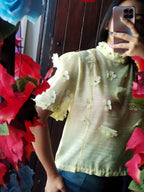 Blusa con flores 3D