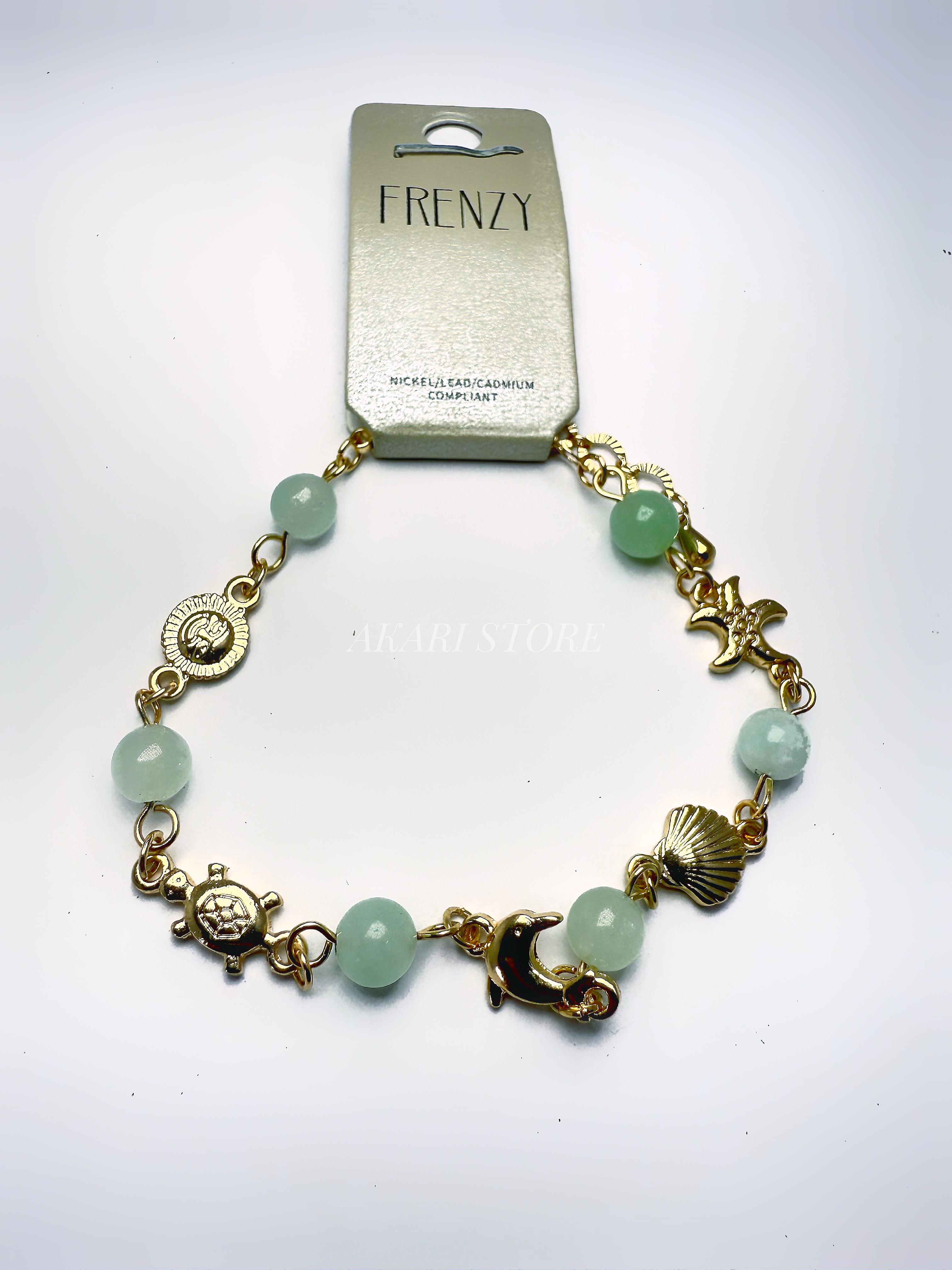 Pulsera dorada con dijes marinos verdes