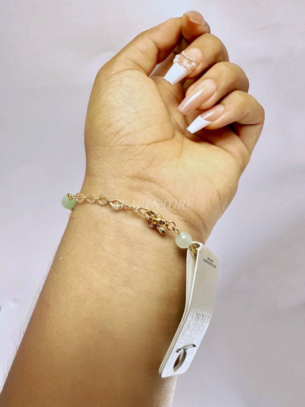 Pulsera dorada con dijes marinos verdes