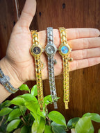 Reloj circular con dije