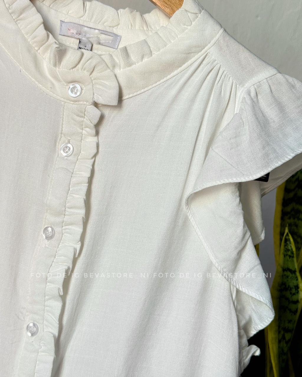 Blusa abotonada con volantes