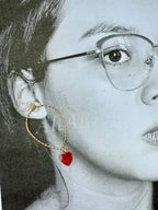 Aretes dorados con colgante de corazón