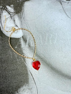 Aretes dorados con colgante de corazón