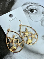 Aretes dorados estrellas de mar y concha
