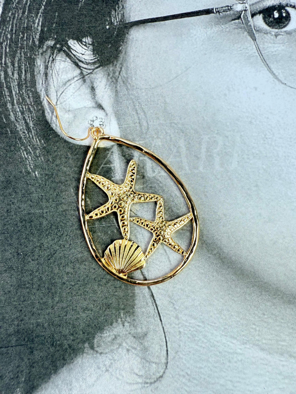 Aretes dorados estrellas de mar y concha
