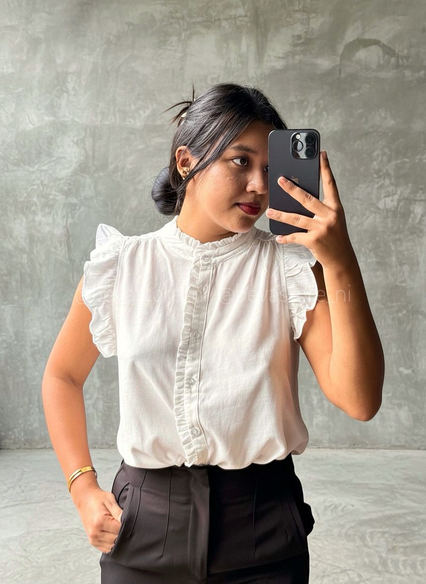 Blusa abotonada con volantes